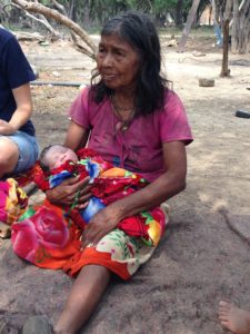 Great-great grandma holding her new grandson