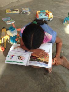 LOVE that they are so interested in books, even though they can't understand them!